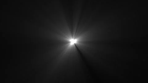 Seamless volumetric light in dark scene. Bright white optical lens flare rays Stock Footage 334043617
