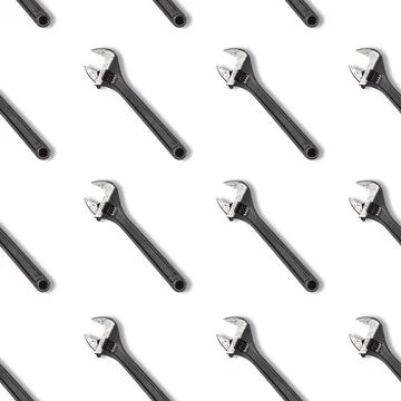 Seamless wrench pattern on white background. Repair service concept. Adjustable Stock Photos