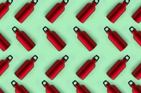 Seamless zigzag pattern made of red steel water bottles on green background Stock Photos
