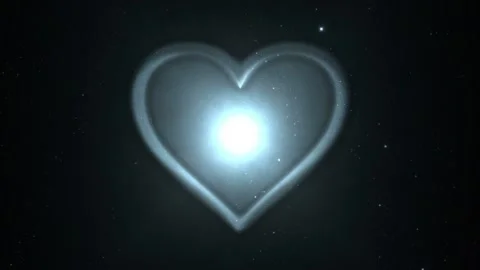 Seamlessly looped motion background shows a romantic glowing heart symbol Stock Footage 160610134