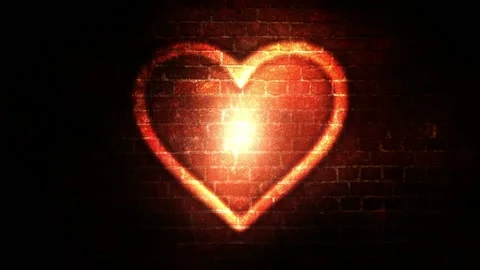 Seamlessly looped motion background shows a romantic glowing heart symbol Stock Footage 160611386