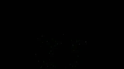 Seamlessly looping animation of colorful glowing firework explosions with Stock Footage 337668729