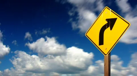 Seamlessly looping clouds with yellow turn sign in front. HD720 progressive. Vidéo 291708