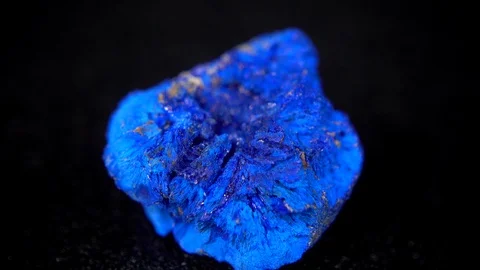 Seamlessly rotating a blue mineral (Azurite) in front of black background Stock Footage