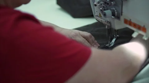Seamstress behind the sewing machine Stock Footage 84043230