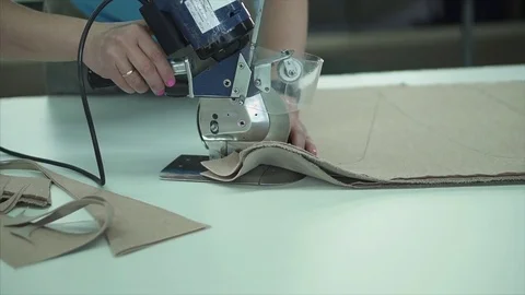 Seamstress behind the sewing machine Stock Footage 84043237