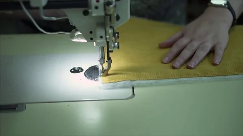 Seamstress behind the sewing machine Stock Footage 84043242