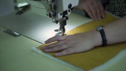 Seamstress behind the sewing machine Stock Footage 84043255