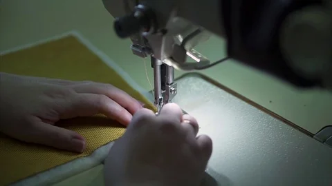 Seamstress behind the sewing machine Stock Footage 84043267