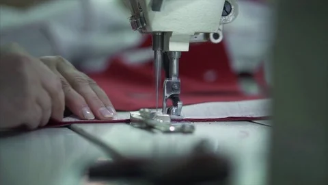 Seamstress behind the sewing machine Stock Footage 84043502