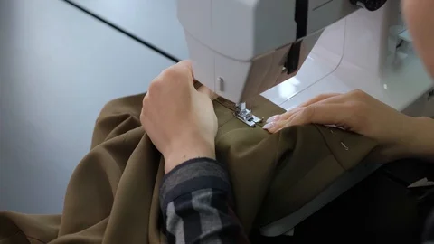 A seamstress creates a pair of pants. Creating the costume design Stock Footage 126726869