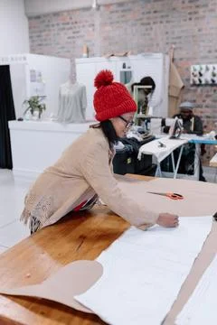 Seamstress creating a pattern to sew Stock Photos