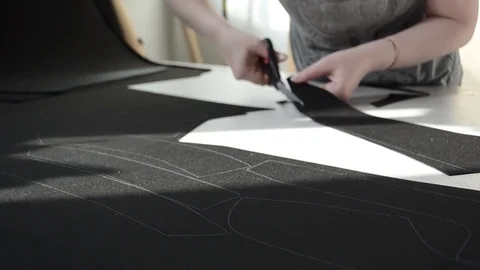 Seamstress cuts out scissor pattern leather for car interior. 스톡 동영상 80726650
