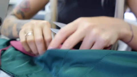Seamstress cuts threads Video stock 115913875