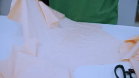 Seamstress hands working with fabric in sewing studio Видео 335931985