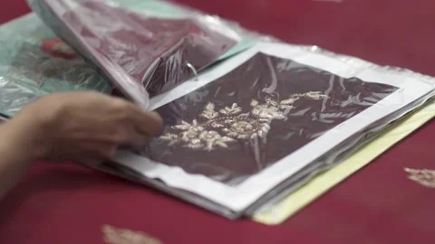 A Seamstress Looks At Decorative Patterns During Manufacturing On Stock Footage 145875829
