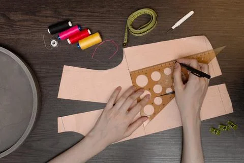 The seamstress makes a pattern. Sewing accessories and tools. Workplace of a Stock Photos