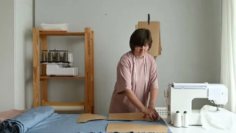 Seamstress making clothes pattern in workshop Stock Footage 208830858