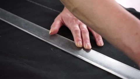 The seamstress marks the pattern on the material Video stock 201718358