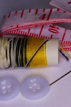 Seamstress Objects including a needle, thread, and tape Stock Photos