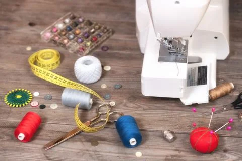 Seamstress or tailor background with sewing tools, colorful threads, sewing Stock Photos