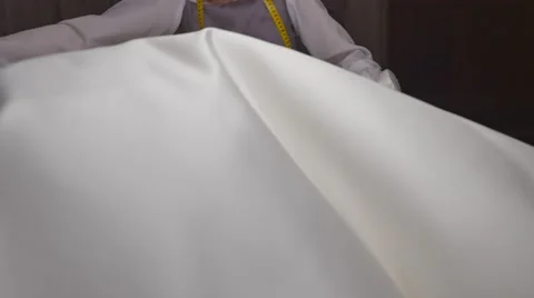 Seamstress prepares materials for cutting Stock-Footage 66494724