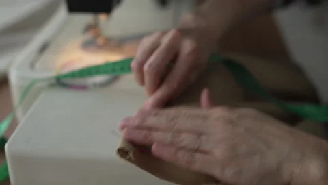 Seamstress preparing fabric for sewing machine Stock Footage 326005360