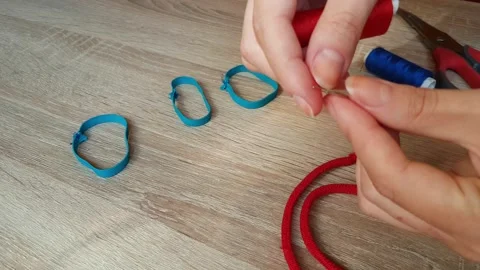 Seamstress Puts Thread In The Eye Of A Needle Stock Footage 153613005