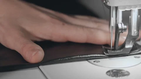 A seamstress scribbles a piece of leather Video stock 144108840