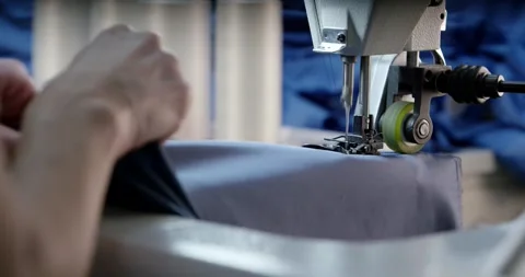 Seamstress Sewing Grey Fabric on Machine, Textile Workshop, Close Up Shot Stock Footage 340363937