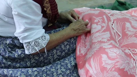 Seamstress sewing a textile manually Stock Footage 245223269