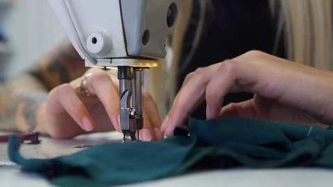 Seamstress sews Video stock 115914047