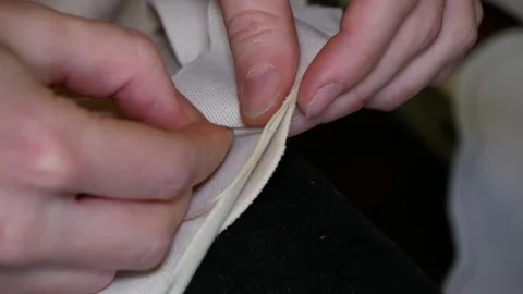 Seamstress sews by hands. Stock Footage 166702786