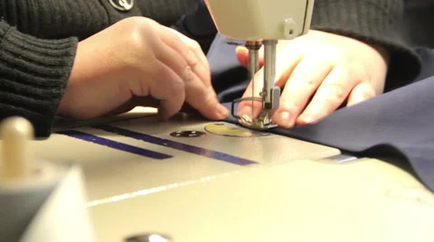 Seamstress sews on the sewing machine Stock-Footage 44725931