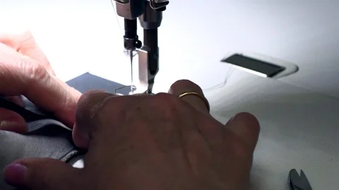 Seamstress sews on a sewing machine Stock Footage 94144023