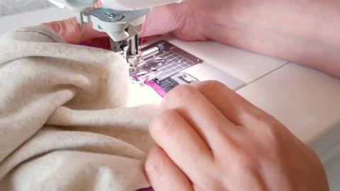The seamstress slowly scribbles clothes. Video stock 135863378
