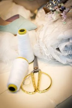 Seamstress thread and scissors Stock Photos