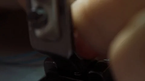 Seamstress is threading a sewing machine. Stock Footage 99815472