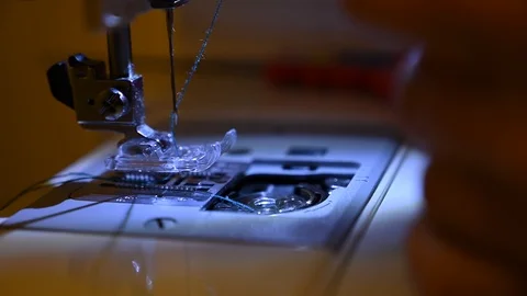 Seamstress uses the sewing machine Stock Footage 126997560