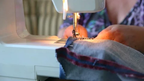 Seamstress using sewing machine, essential ability, basic household chore Stock Footage 141533014