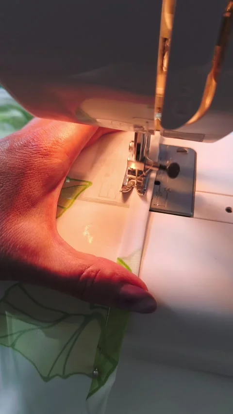 Seamstress at work: close-up of sewing on a sewing machine Stock Footage 314513634