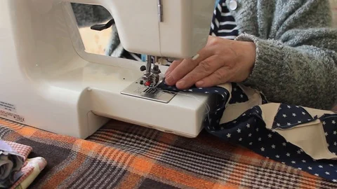 Seamstress work hand made sewing on a sewing machine tailor hand Stock Footage 101869686