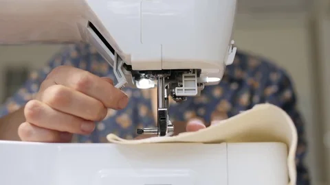 Seamstress at work on a sewing machine close-up Stock Footage 81578134