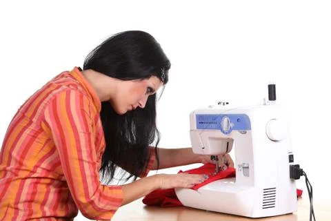 Seamstress work on the sewing-machine Stock Photos