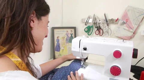 Seamstress working at sewing machine  Stock-Footage 62449211