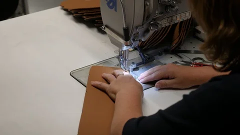 Seamstress working on sewing machine Video stock 90740336