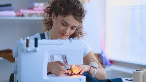 The seamstress working with a sewing machine Stock Footage 107652877