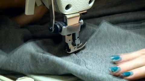 Seamstress Working on Sewing Machine Process. Female Worker Stitching, Rotating Video stock 68029962