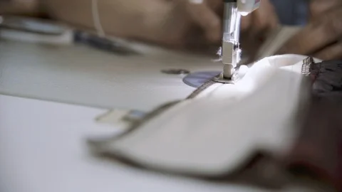 Seamstress works on a sewing machine. Stock Footage