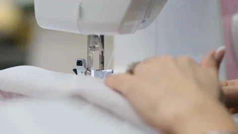 Seamstress's hands behind the machine Vídeos de archivo 120897623